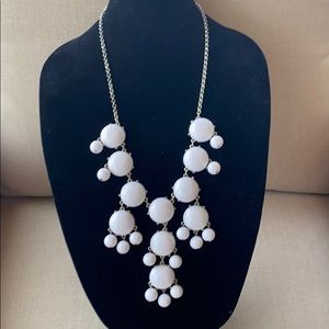 White  costume jewelry bauble necklace.